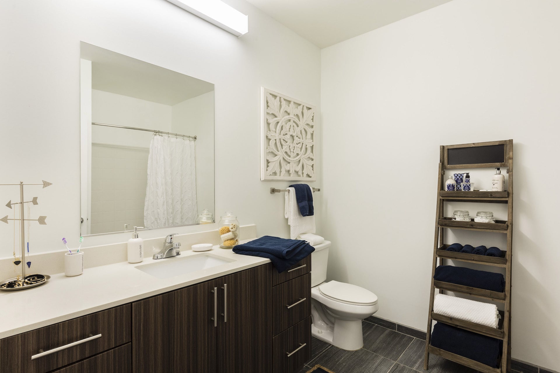 large bathroom with modern cabinets at slate at 901 apartments