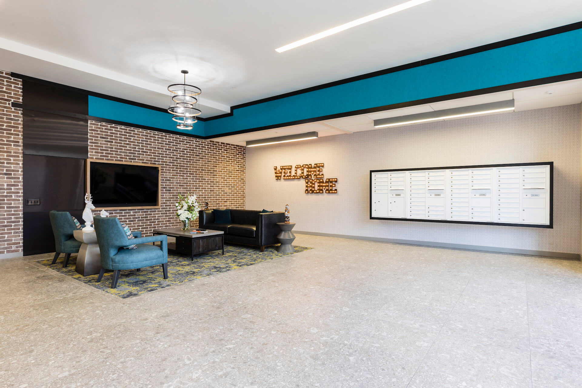 lobby area with mail boxes at slate at 901 apartments